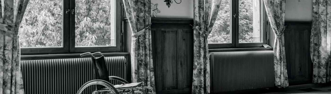 grayscale photo of wheelchair