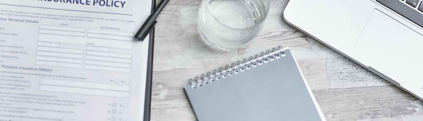 a notebook and laptop on the table