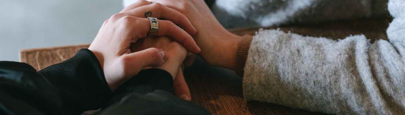 person in black long sleeve shirt and silver ring