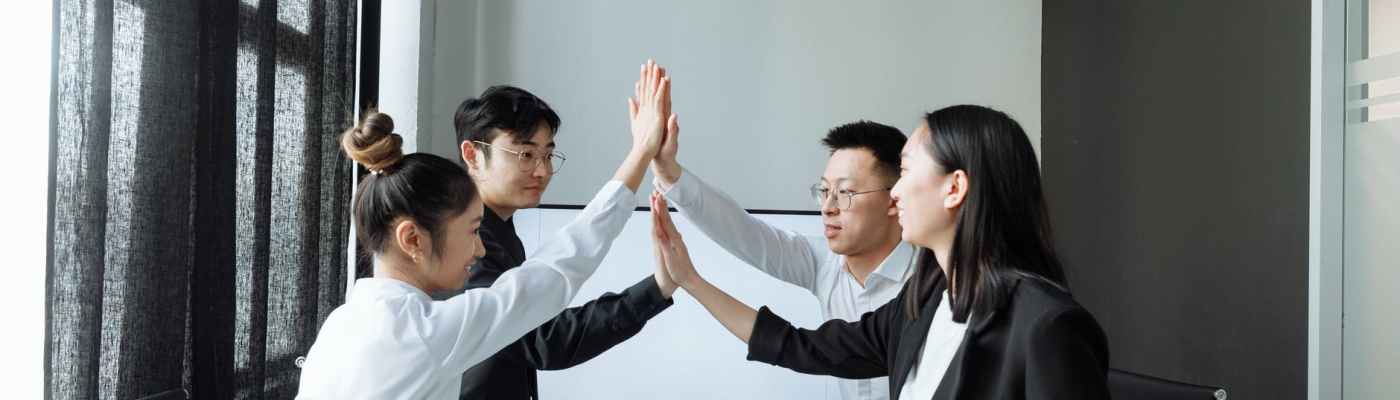 a group of people having a meeting in the office