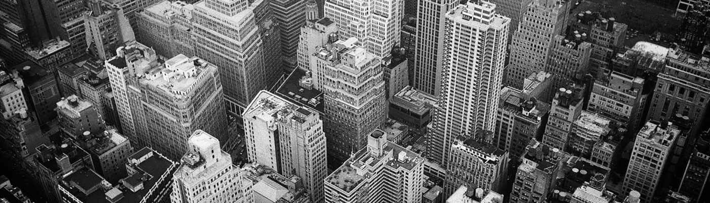 aerial view and grayscale photography of high rise buildings