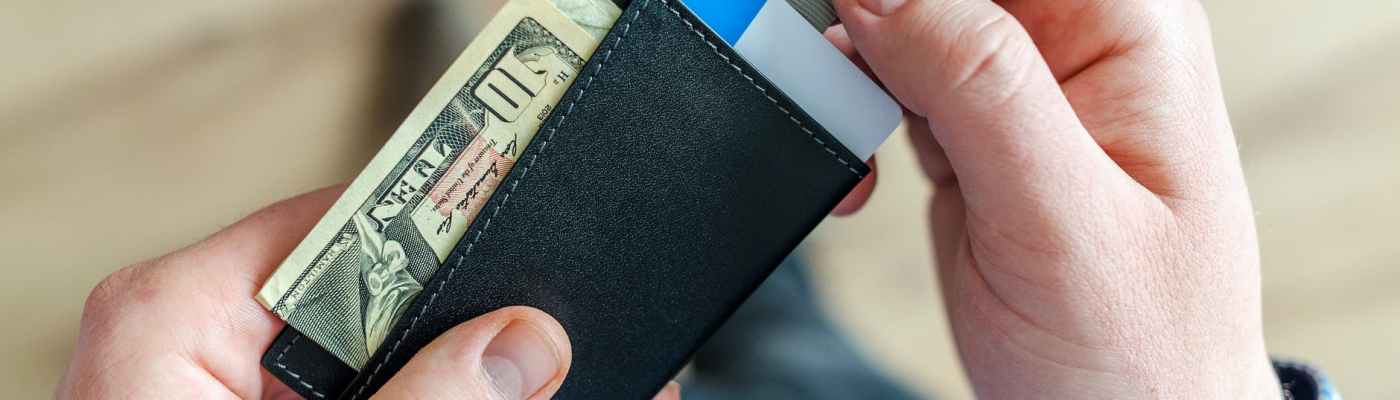 person holding black card holder